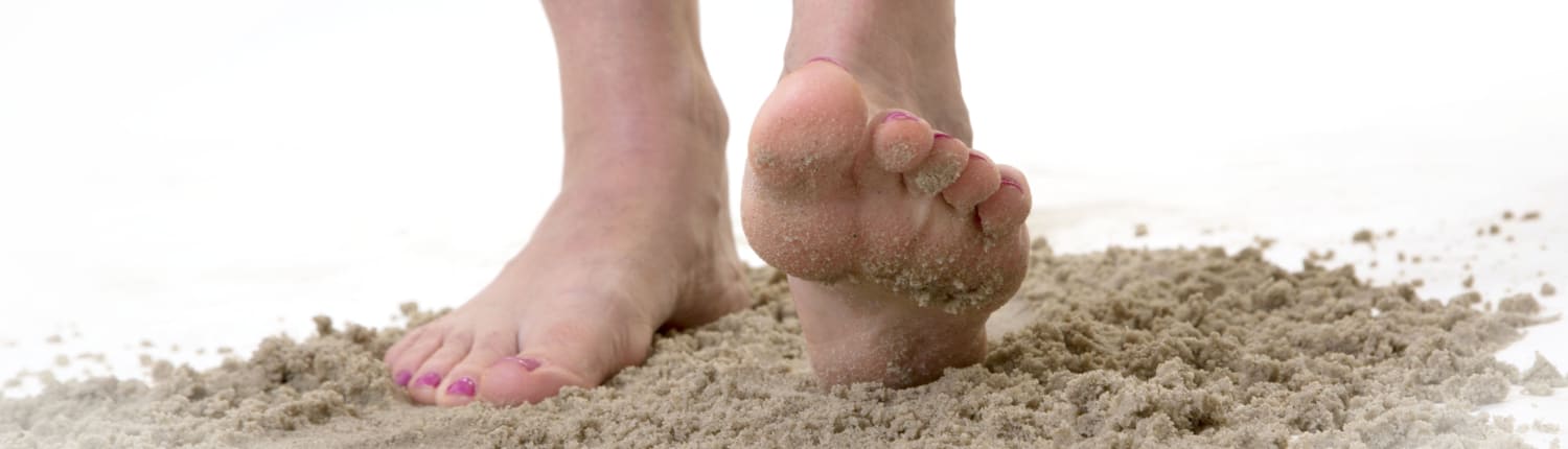 voetjes in het zand